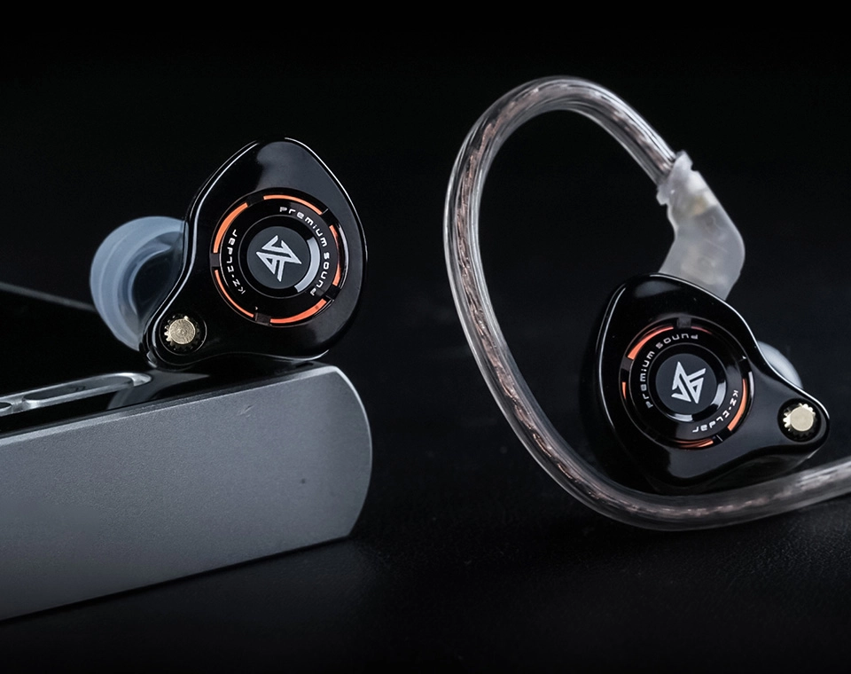 KZ Eldar black earphones beside audio player