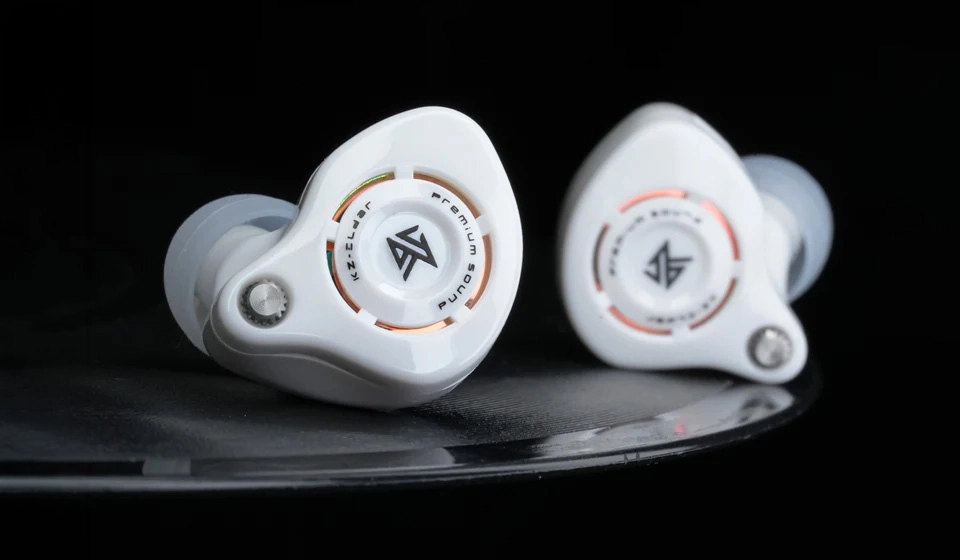 White KZ Eldar earphones on vinyl record