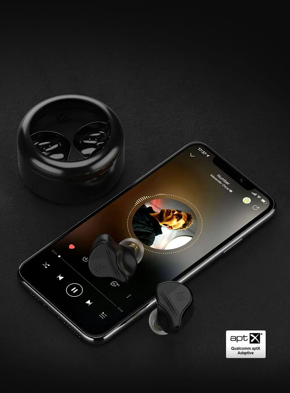 KZ VXS earbuds and charger case next to smartphone